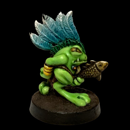 Green fantasy creature with blue hair and a fish, on a white background