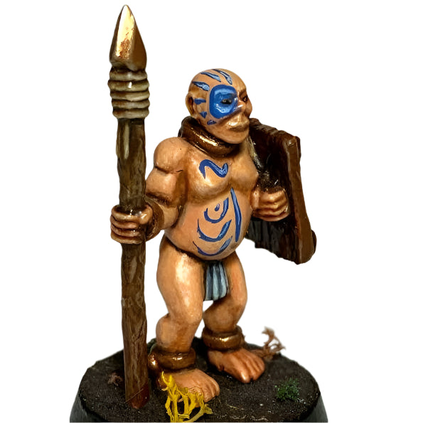 Miniature figurine of a warrior with tribal paint, holding a spear and shield on a gray background